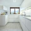 Kuechenhalle-Winnenden-Designkueche-U-Form-weiss-Lack-matt-Griffmulden